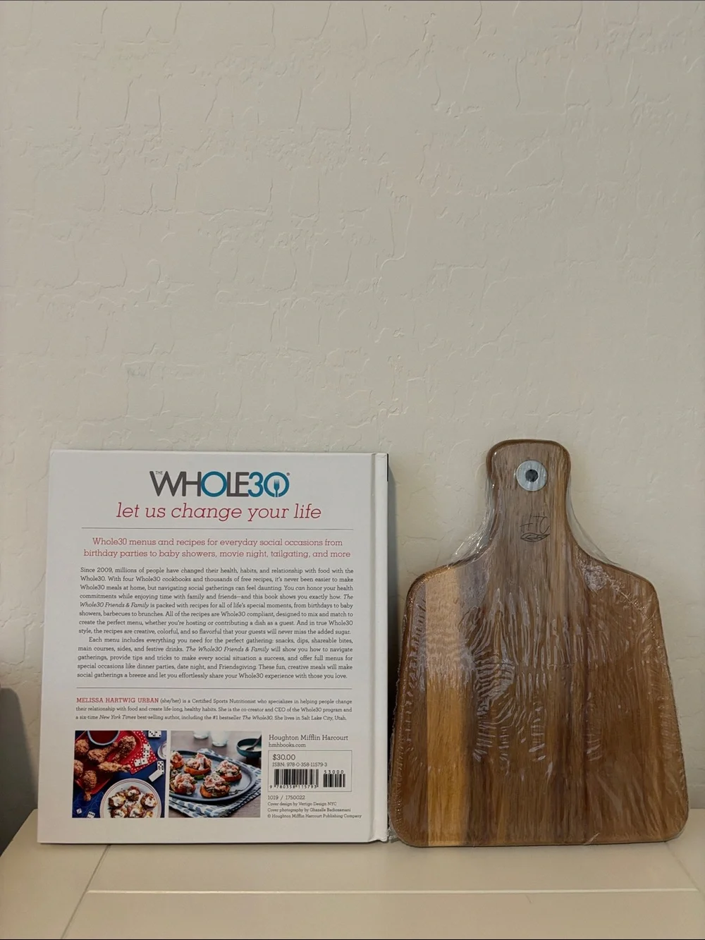 Friends & Family Cookbook & wooden cutting board.
